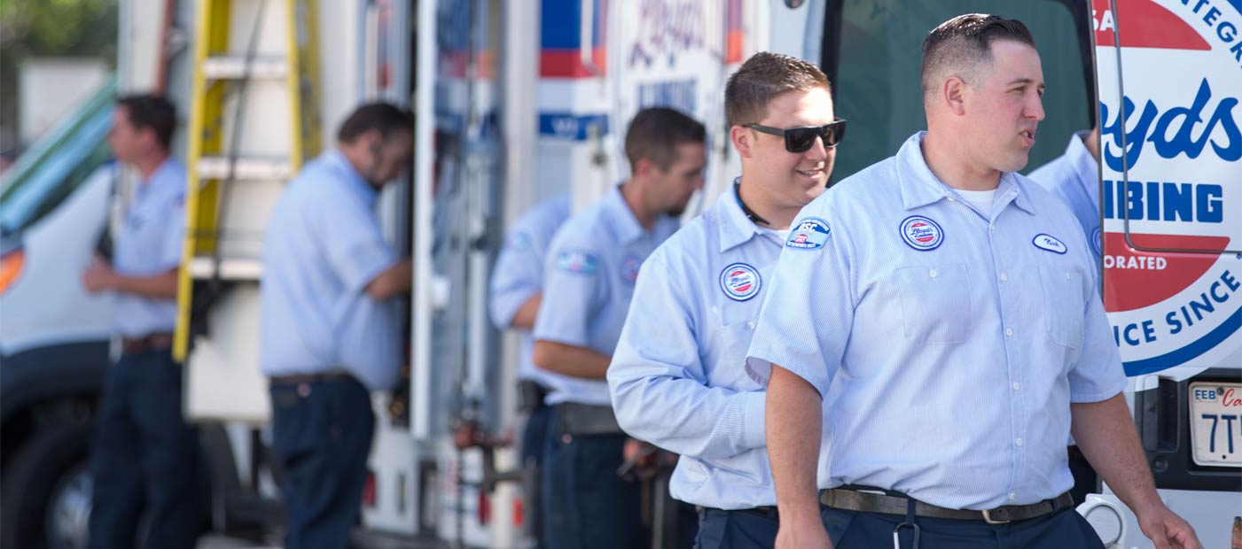Lloyd's Plumbing technicians getting into trucks